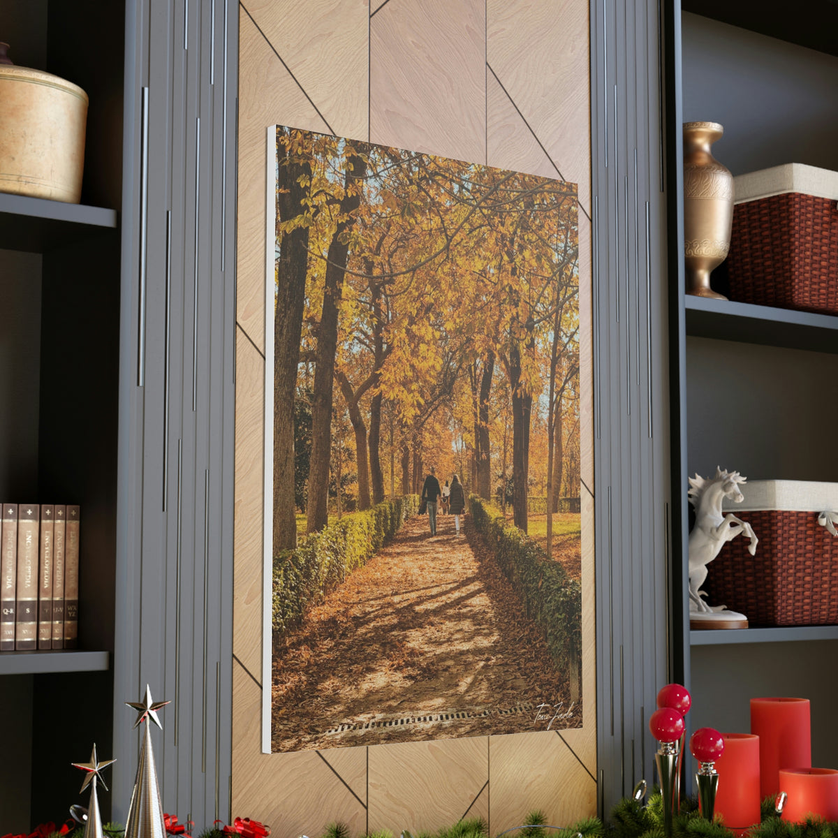 Our fall wall art in Spain is very colorful and vibrant. A couple is walking on the park trail with other families in front, the bright yellow leaves surrounding them. This canvas is a size 32 x 48.